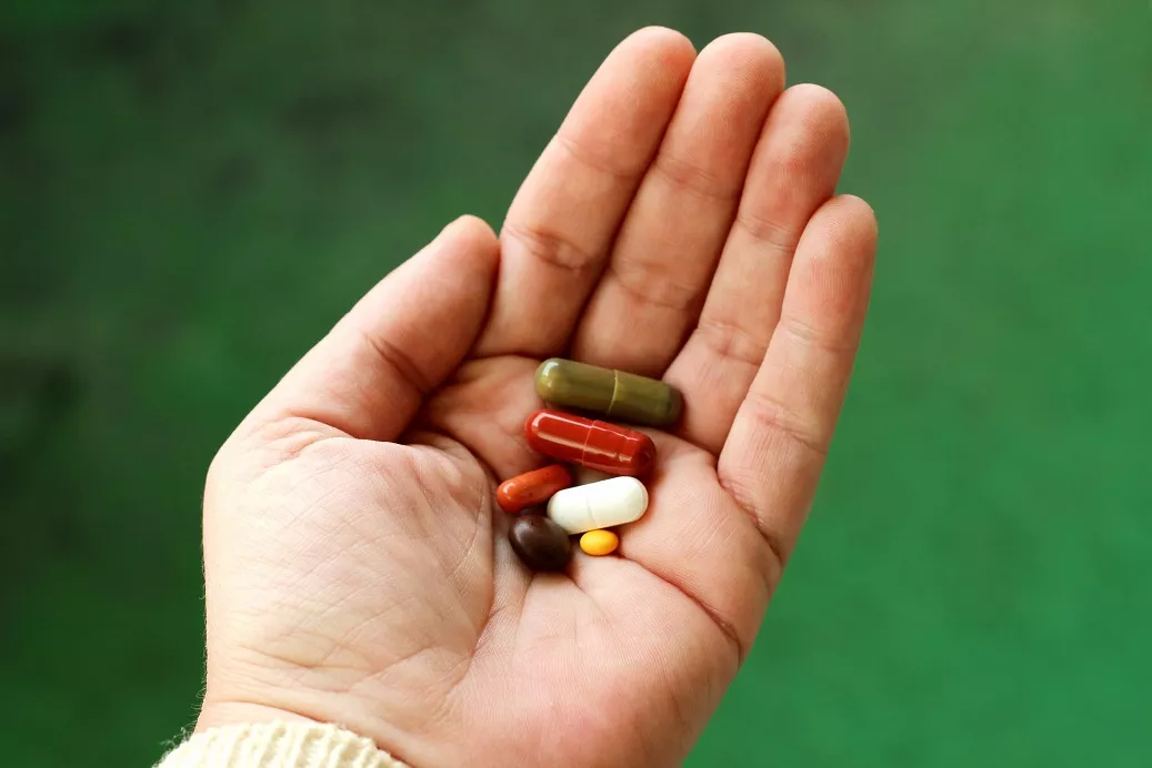 Pills on a human's hand